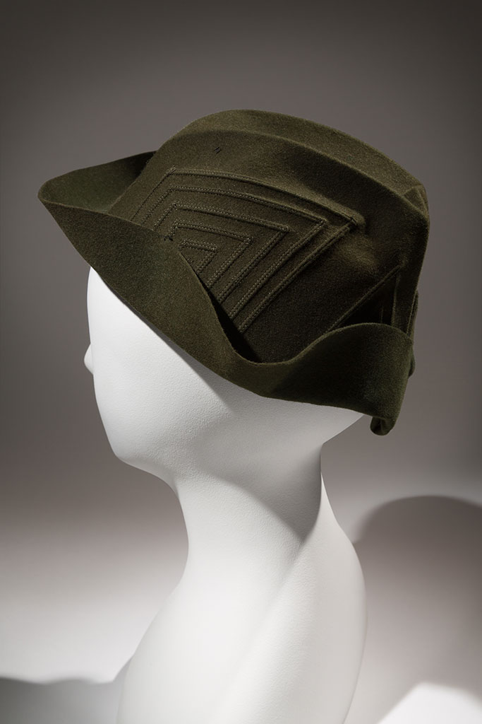 Green felt creased-crown hat with stitched geometric design, maker unknown,  circa 1934, possibly New York, gift of Mr. Harry Haas | copyright MFIT. Photo by Eileen Costa