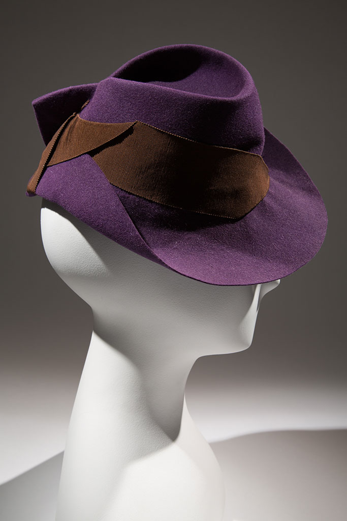 Purple felt and brown grosgrain hat, maker unknown, circa 1936, possibly New York, gift of Mrs. Janet Chatfield-Taylor | copyright MFIT. Photo by Eileen Costa