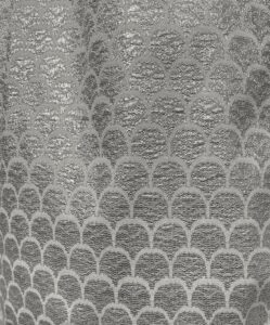scalloped or fishscale pattern in silver metallic synthetic fabric