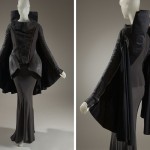 Rick Owens Suit. Distressed black leather and asymmetrical zippers link this ensemble to the archetypal biker jacket. By pushing the boundaries of the original biker jacket design, Owens skillfully integrated sculptural details that are typical of his rebellious and refined style. Off-black denim, wool felt, leather, grey ribbed knit, Fall 2008, France, 2010.94.1, gift of Rick Owens