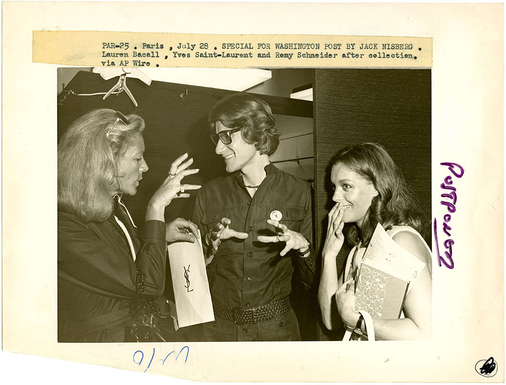 Lauren Bacall, Yves Saint Laurent, and Remy Schneider after an Yves Saint Laurent collection presentation, Paris, undated, Photograph by: Jack Nisberg, Nina Hyde Collection, FIT Special Collections Library