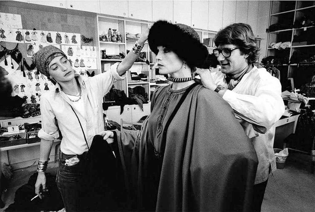 Loulou de la Falaise and Yves Saint Laurent styling the model Willy van Rooy, 1974. Via 