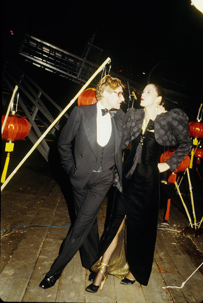 Yves Saint Laurent and Marina Schiano in an evening  gown by the designer during the New York launch party for his “Opium” perfume, October, Fairchild Archive. Photograph: Tony Palmieri