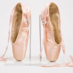 Capezio | Salvatore Capezio founded his eponymous company in 1887, and was established as a premier maker of ballet shoes by the early twentieth century. These “Duro Toe” pointe shoes exemplify one of Capezio’s numerous innovations. Patented shortly after the stock market crash of 1929, they feature suede over the toe (rather than delicate satin), allowing for longer wear. Capezio “Duro-Toe” pointe shoes, 1941 (patented 1930) The Museum at FIT, 86.21.48 Gift of David P. Dann