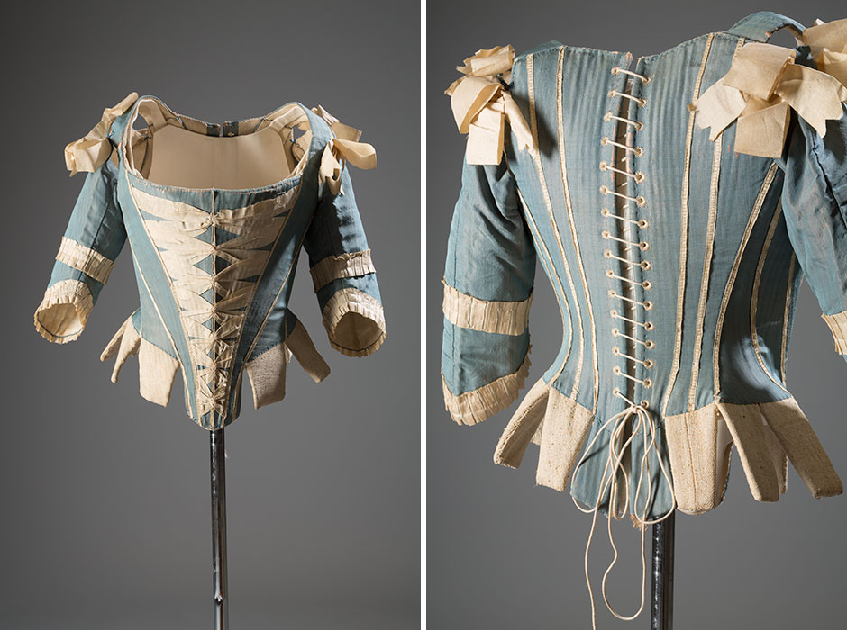 Stays were obligatory for the “strait-laced” woman of the eighteenth century. Although they were associated with respectability and high social status, stays also held an erotic allure. In France, the toilette—a semipublic ritual of dressing and undressing—included the subtheme of putting on a corset. Stays with sleeves are rare, and may indicate that this corset was part of an at-home ensemble. Light blue silk, silk ribbon, whalebone, circa 1770, USA, P82.1.16, museum purchase