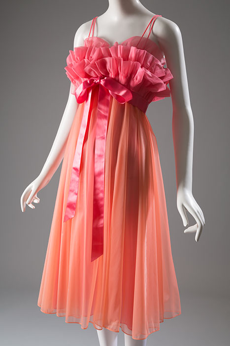 Actress Carroll Baker wore a hip-length, ruffled nightie and matching pantalets in the 1956 movie Baby Doll. The movie helped to popularize short, billowing sleepwear styles. Vanity Fair was known for its fashionable and brilliantly colored nylon sleepwear, which was both inexpensive and easy to care for. Nylon tricot, circa 1960, USA, 87.82.5, gift of Dorothy Pollack