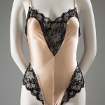 Teddies were derived from the combination undergarments of the early 20th century. By the 1980s, they had become especially provocative. In 1988, Intimate Fashion News reported that designers continued to “tempt the consumer to add more styles to her teddy wardrobe,” describing styles with “briefly cut silhouettes . . . high-cut legs and revealing spaghetti-strap bodices.” Silk charmeuse, lace, circa 1988, USA, 2012.53.7, gift of Leigh Bantivoglio