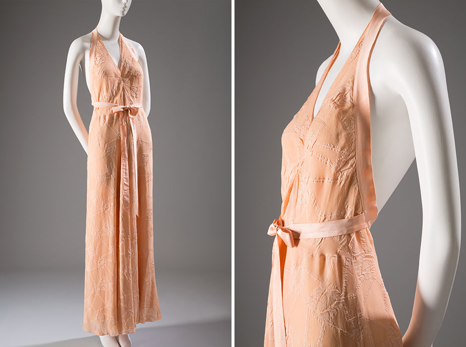 Halter-neck gowns became fashionable during the 1930s. Although a revealing neckline was most commonly used for evening dresses and swimsuits, it was also well-suited to intimate apparel. The intricately woven silk used to make this example has a “patchwork” pattern, providing texture and visual interest without interrupting the gown’s streamlined silhouette. Novelty woven silk, silk satin, 1940, France, 82.151.61, gift of Mrs. Jefferson Patterson