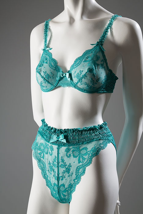 Victoria’s Secret was founded as a mail-order catalog in 1977, corresponding to renewed interest in ultra-feminine lingerie styles. Now a household name, the brand specializes in designs that are stylish and sexy, yet accessible. Brightly colored fabrics, such as the teal lace used for this set, have become a hallmark of the Victoria’s Secret style. Lace, 1990, USA, 90.161.3, gift of Victoria’s Secret