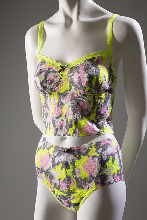 This camisole and panty set is part of a collaboration between Hanky Panky and Gwen Stefani’s fashion brand, L.A.M.B. The fluorescent camouflage print reveals influence from street fashion— an important element of Stefani’s creations. The set’s retro styling underscores both Stefani’s and Hanky Panky’s appreciation for vintage clothing and lingerie. Stretch lace, Fall 2014, USA, 2014.9.1-.2, gift of Hanky Panky Ltd.