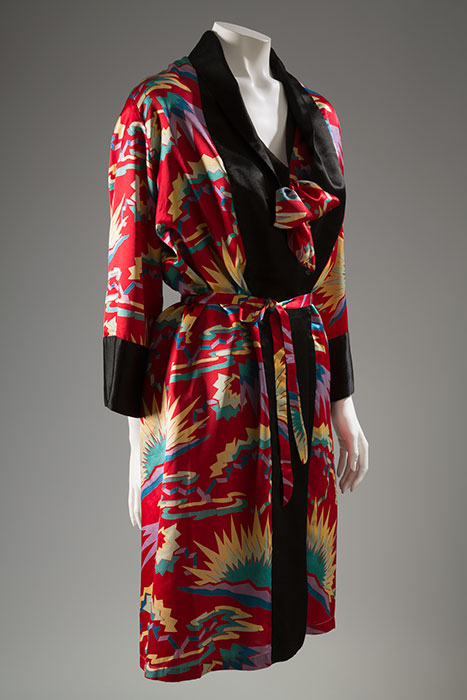 It is likely that this robe and blouse were originally part of a set of lounging pajamas. First seen in the pages of Vogue during the 1910s, many lounging pajamas showed influence from Asia and the Near East. They often featured loose tunics or kimono-style tops over wide-legged trousers. Silk, circa 1930, probably USA, 90.190.20, gift of Elinor Toberoff