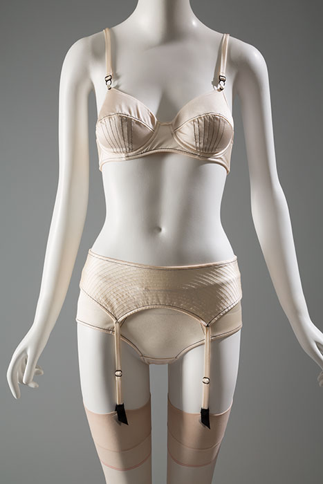 This ensemble was part of the first lingerie collection by Belgian brand A.F. Vandervorst. The label’s designers, Filip Arickx and An Vandervorst, based their designs on their studies of traditional French corsetry. The lingerie was shown on the runway alongside their outerwear creations—many of which also showed influence from classic lingerie styling. Stretch silk, nylon/spandex, 2006, Belgium, Nightfall collection, 2006.42.1, gift of A.F. Vandervorst