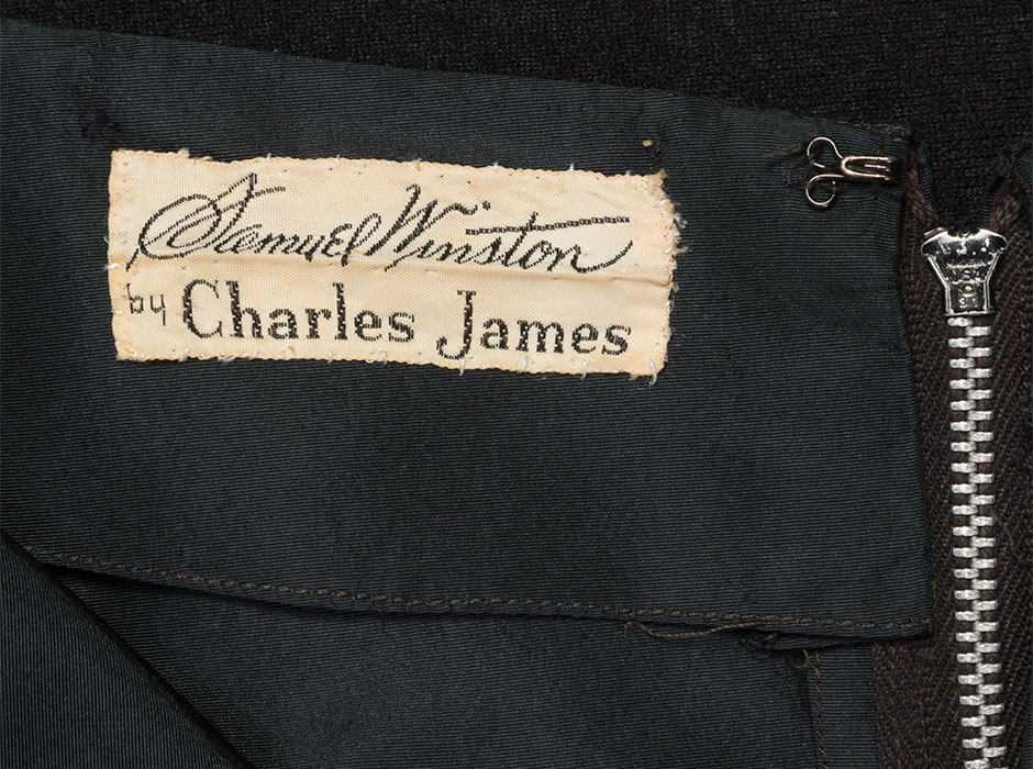 Detail, label of Samuel Winston by Charles James cocktail dress. Dress: silk faille, tassels, 1952-1954, USA, 2010.27.1, gift of Judy Wada and Edward Weisberger