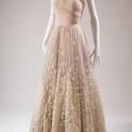 The cascading, hand-appliquéd feathers on this dress attest to the extraordinary craftsmanship associated with Pierre Balmain’s haute couture designs. However, this licensed copy was created by Orcilia, a Cuban department store. Cuba was the second largest importer of couture, after the United States. Tulle, feathers, 1946-1947, Cuba, 80.304.1, gift of Molly Milbank