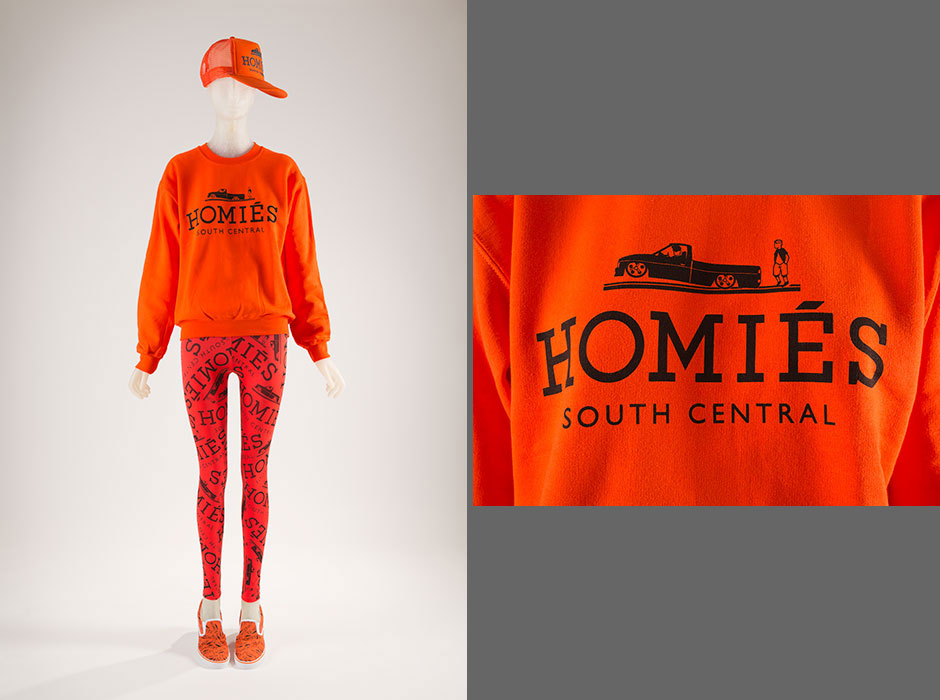 This “Homiés” ensemble is a sly parody of the Hermès logo. Drawing on the Latin lowrider subculture in South Central, Los Angeles, Brian Lichtenberg replaced Hermès’s carriage attached to a horse with a truck on hydraulics. This collection has raised debate among lawyers, scholars, and the press regarding trademark infringement and parody as a protected form of speech. Cotton and polyester blend, polyester knit, 2014, USA, 2014.39.1, gift of Brian Lichtenberg Studio