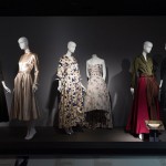 Christian Dior commissioned chiné velour au sabre textiles for several of his collections. This luxury fabric is created by first handdying the warp threads to create the blurred effect referred to as chiné. Then, certain parts of the silk satin are hand-picked, using a saber tool to create the velvet pile. Center left: Christian Dior, evening coat, chiné velour au sabre, circa 1951, France, 91.121.3, gift of Mrs. Sylvia Slifka For her cocktail dress, American designer Carrie Munn used a French textile similar to the one in the Christian Dior coat at left. The raised velvet surface of the ciselé fabric was created by cutting loops of silk. The press often favorably compared Munn’s work to that of Dior and Cristóbal Balenciaga. Her celebrity clientele included Mrs. Elizabeth Parke Firestone, wife of the tire mogul. Center right: Carrie Munn cocktail dress, chiné ciselé velvet, circa 1955, USA, 93.80.9, gift of Mrs. Harry W. Lunger