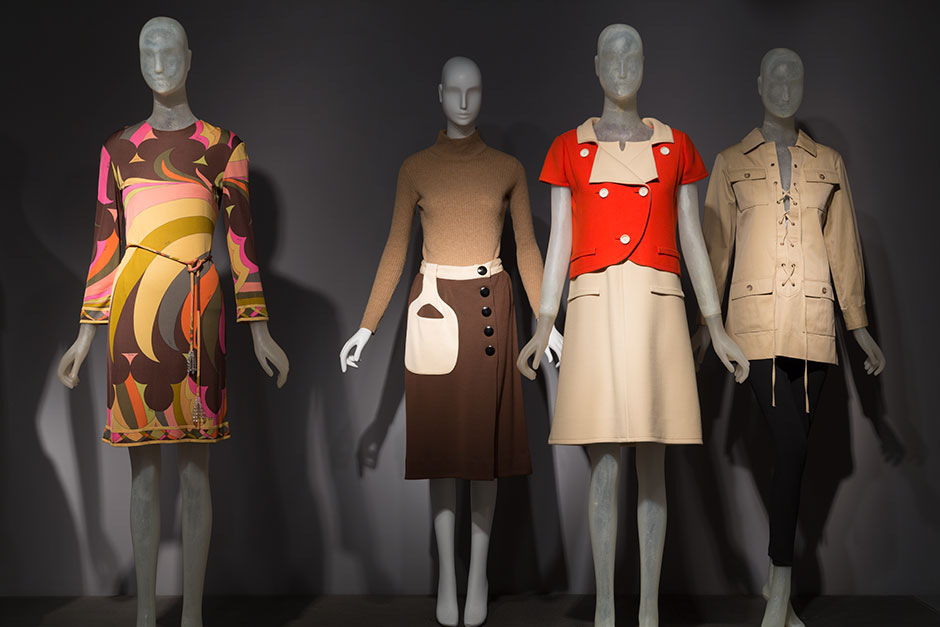 Left to right: Emilio Pucci dress, silk jersey, glass beads, circa 1960, Italy, 2005.38.1, gift of Elaine Stone Andre Courrèges dress and jacket, wool gabardine, 1965, France, 77.183.3, gift of Ruth Sublette In 1965, Andre Courrèges temporarily closed his couture house because he was frustrated by widespread copying of his designs. He reopened in 1967—with the addition of a ready-to-wear collection called “Couture Futures.” Yves Saint Laurent Rive Gauche, safari jacket, cotton, 1968, France, 85.46.3, gift of Mrs. Alida Miller-Frisch In 1966, couturier Yves Saint Laurent opened his ready-to-wear boutique Rive Gauche (Left Bank). This marked the acceptance of ready-to-wear in France, a response very different from the backlash Pierre Cardin received when he made a similar move only seven years earlier. Saint Laurent’s safari jacket was sold in his boutique, visible behind him in the photo at right.