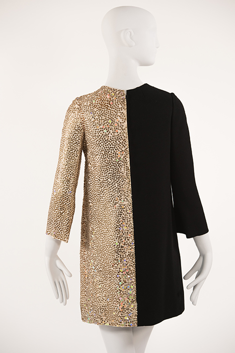 back of dress that is half gold sequins and half black