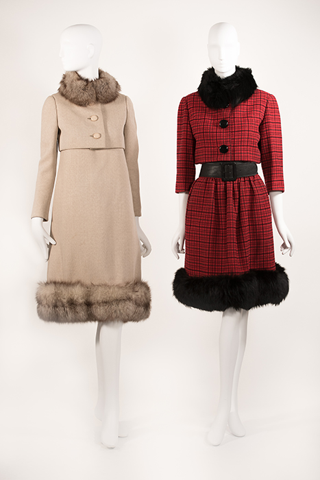 (left) oatmeal colored suit with fur trim around neck and bottom (right) red and black checked 3/4 sleevel suit with black belt and fur trim around neck and bottom