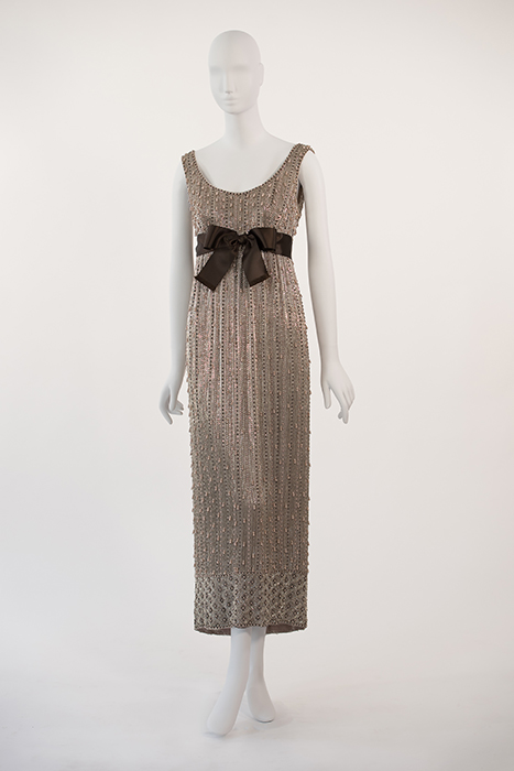 silver and crystal beaded long dress with brown bow tied at waist