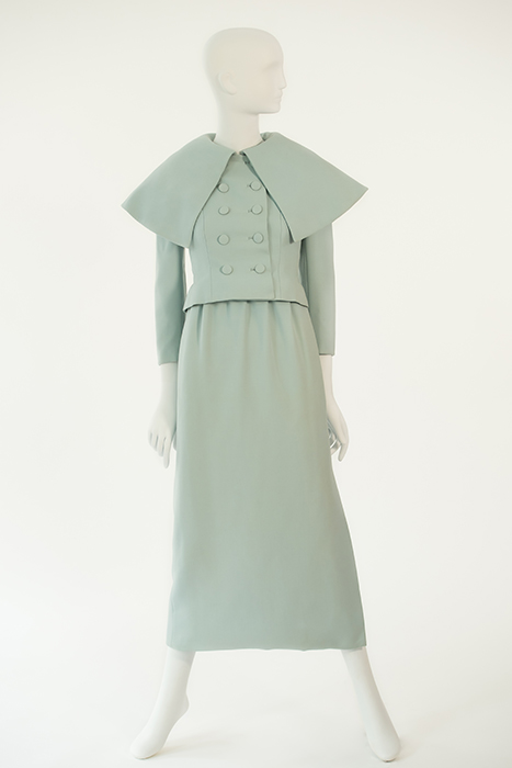 ice blue gown with double-breasted buttons and cape-like collar