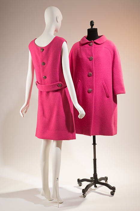 (left) pink short sleeve wool dress with three buttons down center of back (right) pink wool coat with four buttons down center