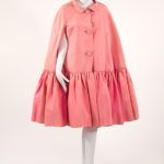 pink cape with three buttons down center
