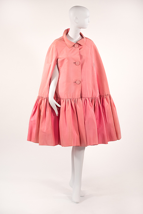 pink cape with three buttons down center