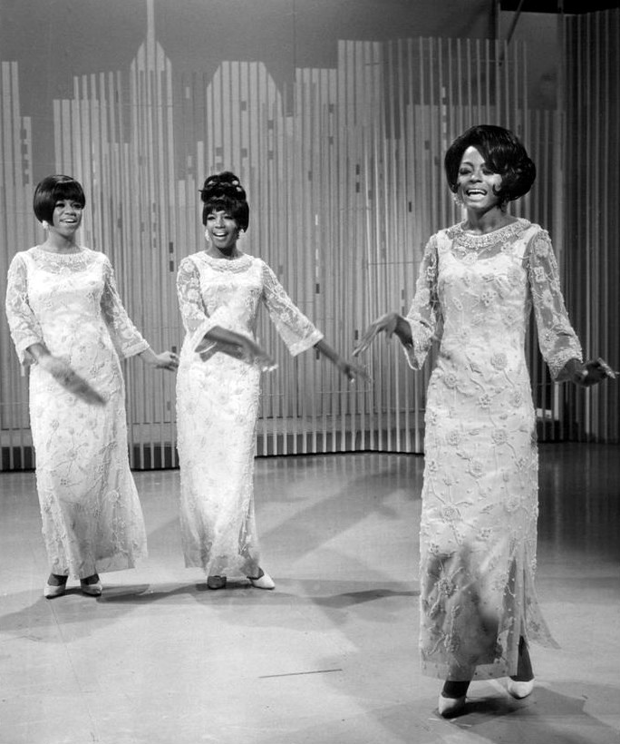 Florence Ballard and Mary Wilson stand behind Diana Ross during a performance on the Ed Sullivan show in 1966