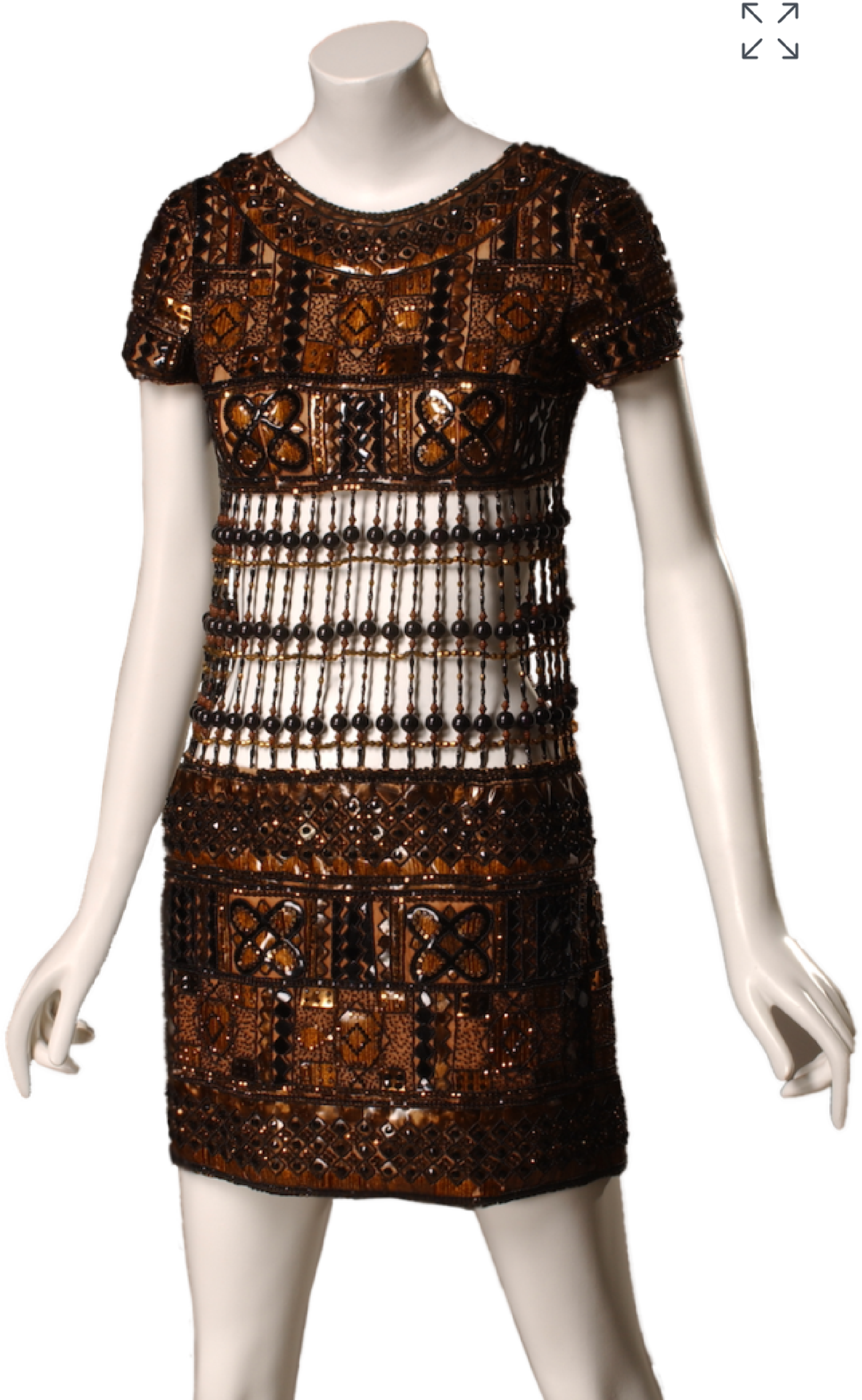 Side view of 1967 Yves Saint Laurent short sleeve brown beaded and embroidered mini evening dress. The mid-section of the dress is cut out and the bodice and skirt are attached using beading.