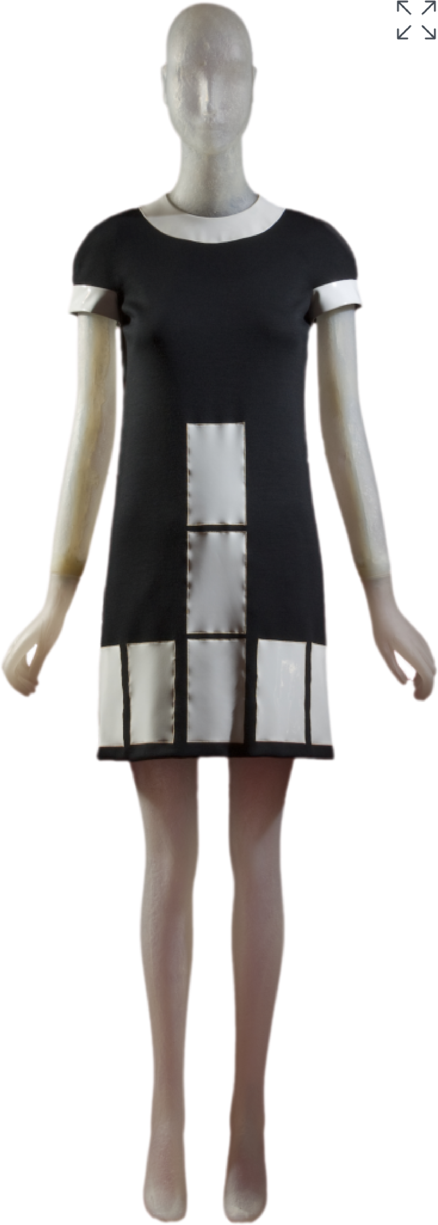 Front view of a 1969 Pierrie Cardin short sleeve black wool mini-dress with rectangular cutouts at the dress hem and center front, revelaing white vinyl rectangles. The hems of the sleeves and collar are finished with white vinyl strips. 