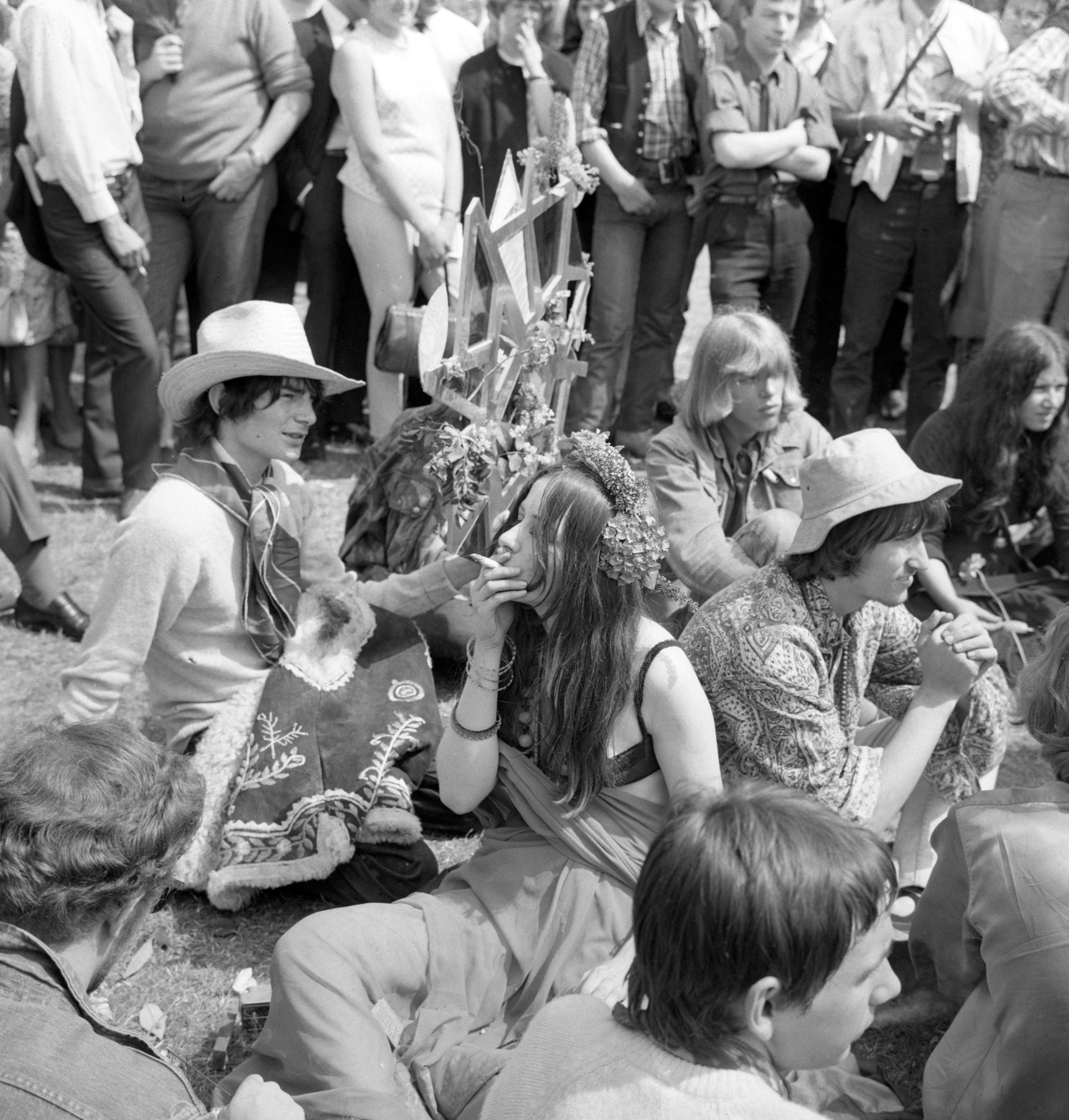 A group of young men and women sit in Hyde Park, London smoking marjuana, 1967