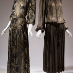 Left: Saint Laurent Rive Gauche, gold and black ensemble, polyester chiffon, 1976, France, 78.57.11, gift of Ethel Scull Right: Yves Saint Laurent gold dress, lamé, 1977, Paris, 83.27.15, gift of Mrs. James Levy